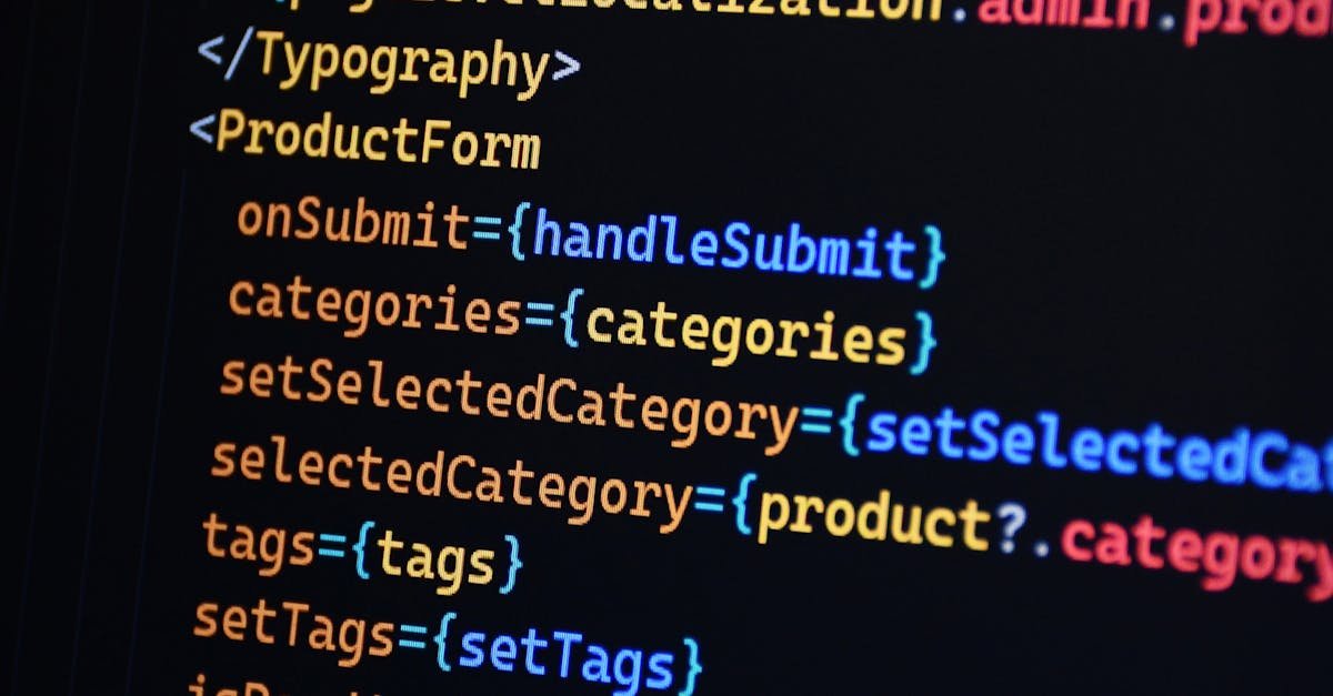 Close-up of JSX code on a monitor, showcasing colorful syntax used in ReactJS development.